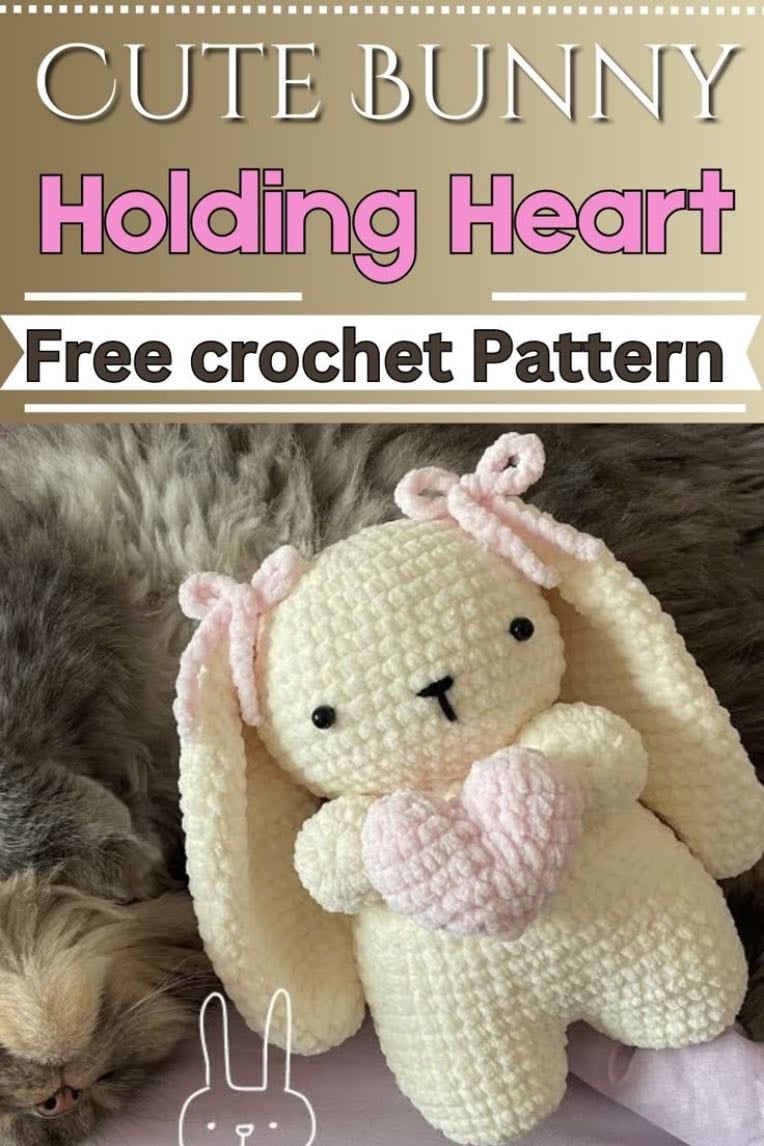 Cute bunny holding heart