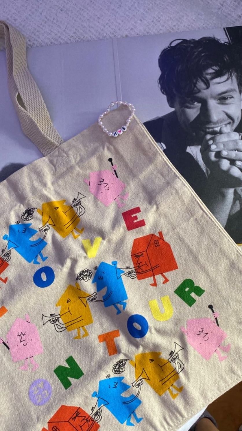 lot bag - itโs not this exact bag but itโs still a love on tour one, nothing much to say about it but i loveee the design of it and i wish i got the matching shirt with it but i might soon!