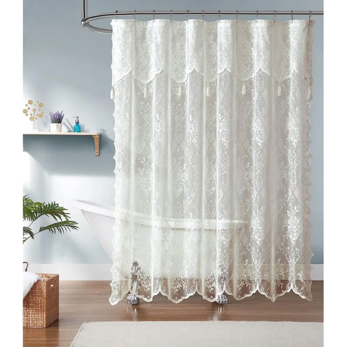 porcelain bathtub with lace shower curtain