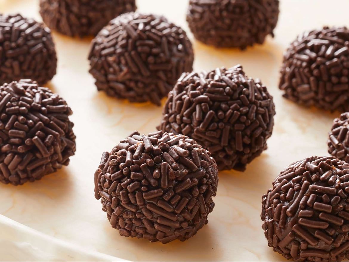 Brigadeiro - Ingredients:
- 1 can of condensed milk
- 1 cup of milk
- 1 and 1/2 tbsp of cocoa powder
- 1 tbsp of butter
Warm up the cup of milk and then add the cocoa powder, mix until completely combined. Then add the can of condensed milk and the tbsp of butter. Stir until unsticks from the bottom of the pan, medium heat stirring constantly so it doesn’t stick or burn.