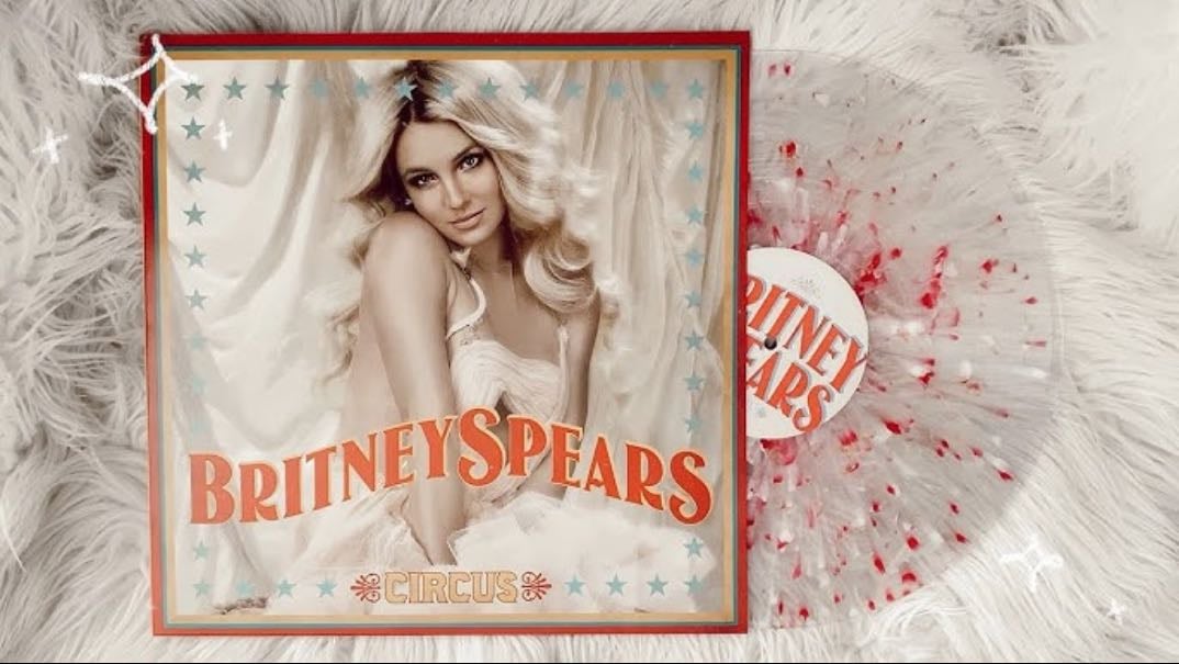 Circus clear w/ red, white, gold splatter édition