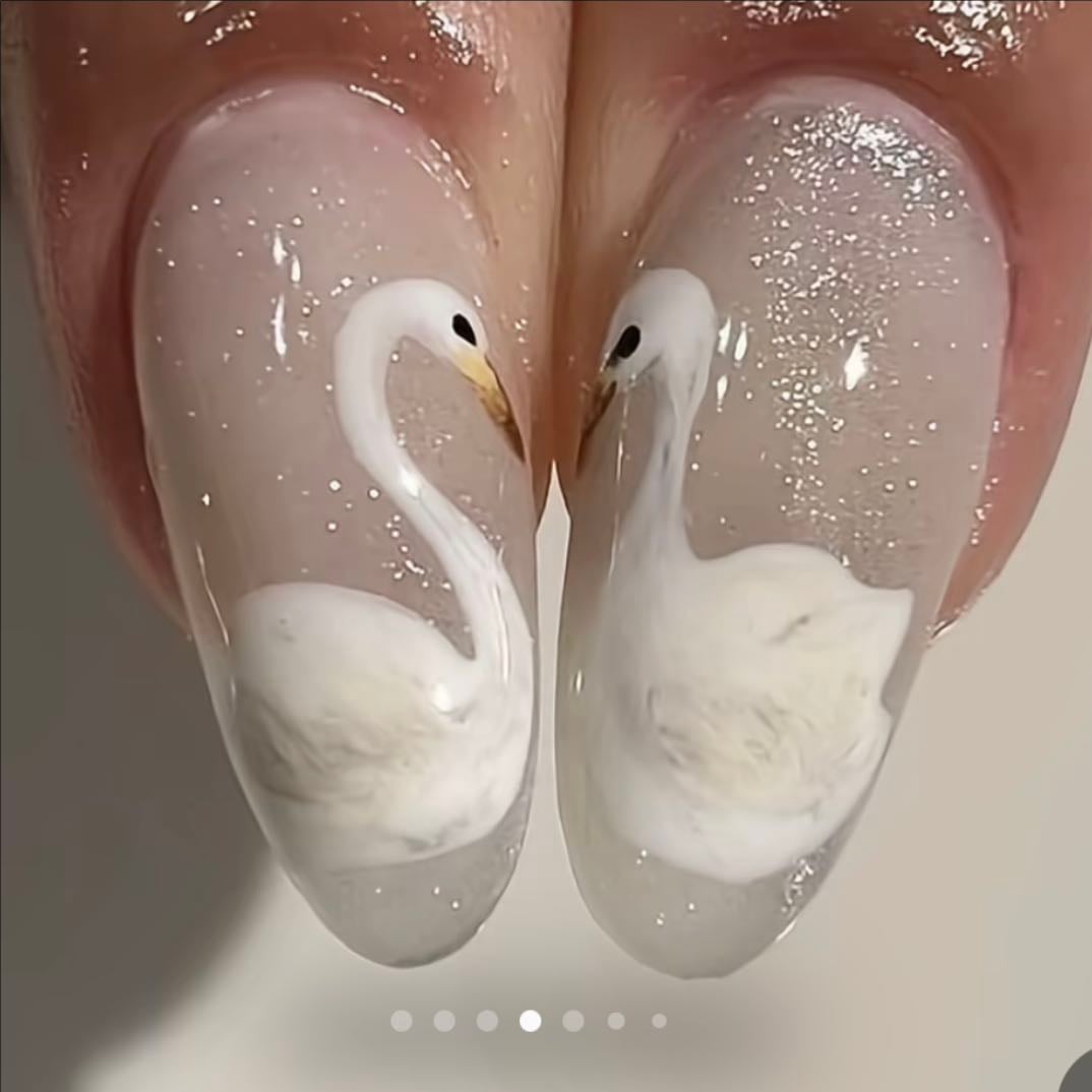 swans looking at each other