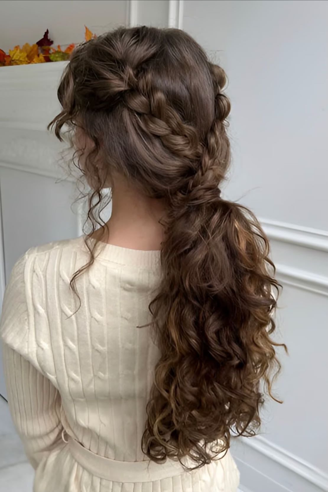 Braids into a low pony