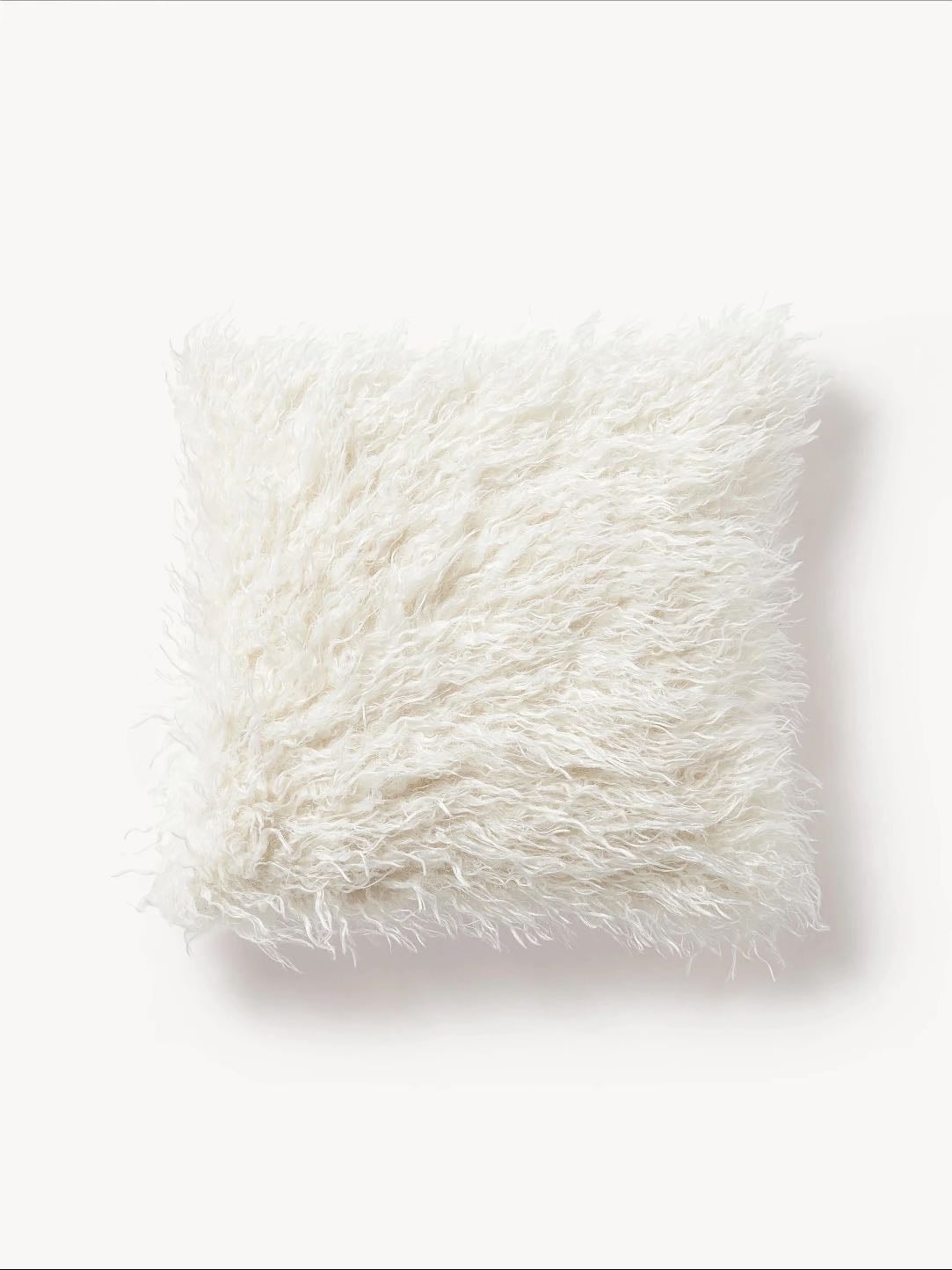 Petit coussin blanc fausse fourrure